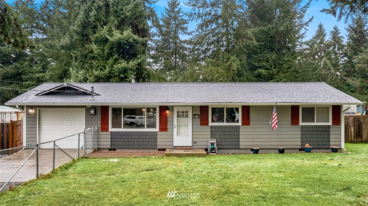 18625 Nutmeg Street Southwest Rochester, WA 98579 - Photo 1 of 18 a front view of a house with a yard