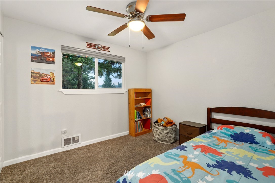 18625 Nutmeg Street Southwest Rochester, WA 98579 - Photo 11 of 18 a bedroom with bed and a window