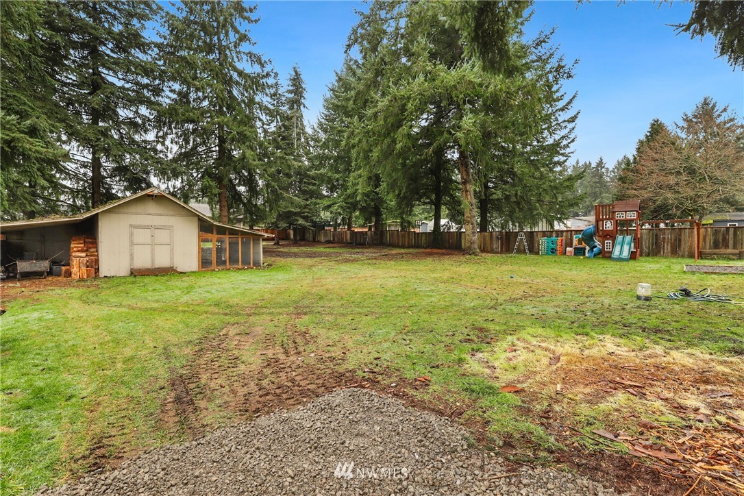18625 Nutmeg Street Southwest Rochester, WA 98579 - Photo 16 of 18 a front view of house with yard and green space