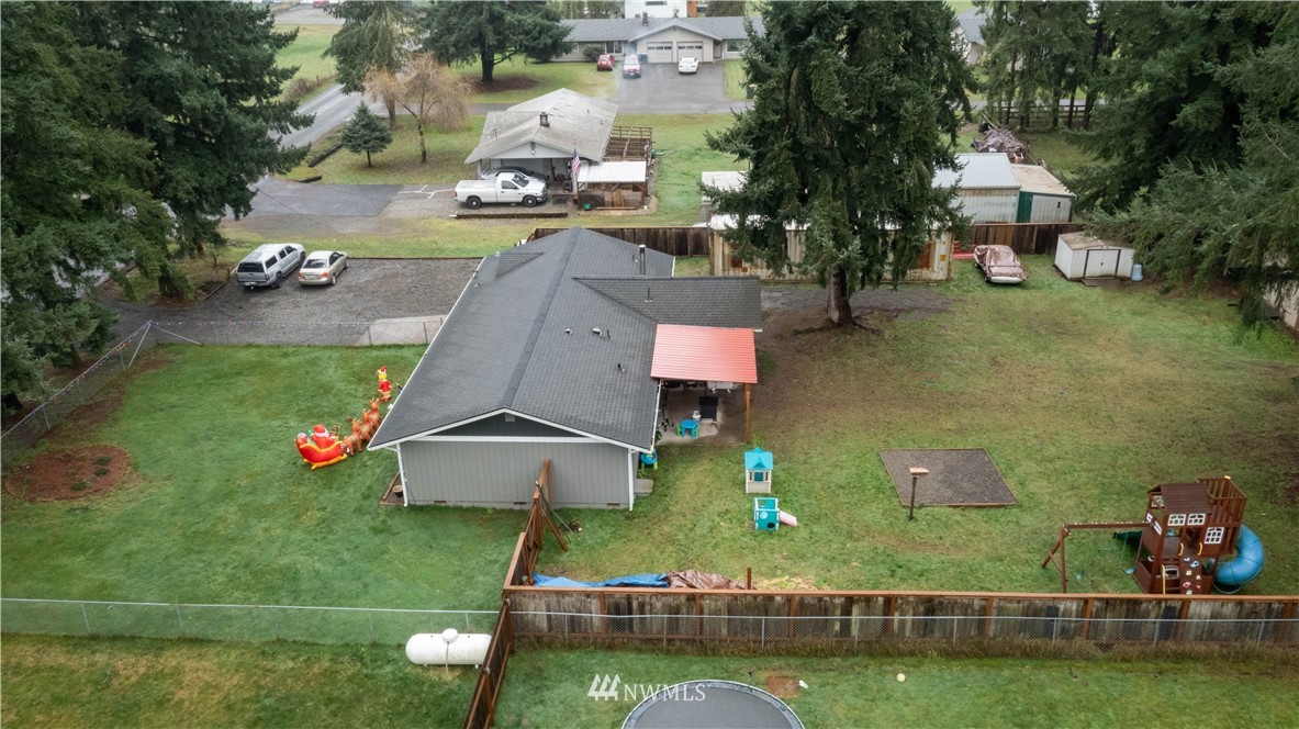 18625 Nutmeg Street Southwest Rochester, WA 98579 - Photo 18 of 18 an aerial view of a house with swimming pool a yard and outdoor seating
