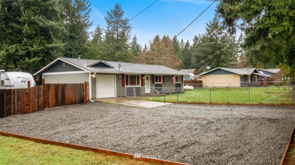 18625 Nutmeg Street Southwest Rochester, WA 98579 - Photo 2 of 18 a house with a trees in the background