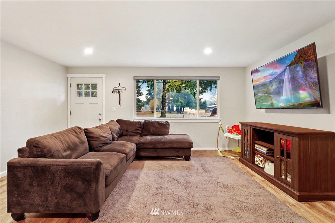 18625 Nutmeg Street Southwest Rochester, WA 98579 - Photo 5 of 18 a living room with furniture and a flat screen tv