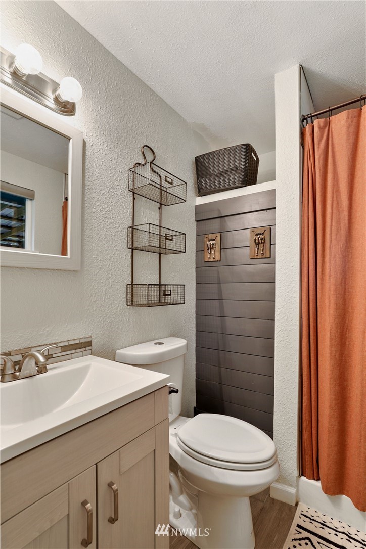 18625 Nutmeg Street Southwest Rochester, WA 98579 - Photo 10 of 18 a bathroom with a sink a toilet and shower