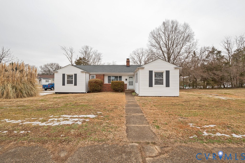 1715 West City Point Road Hopewell, VA 23860 - Photo 2 of 22 a front view of a house with a yard and trees