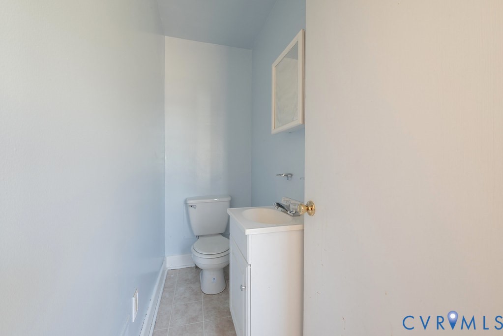 1715 West City Point Road Hopewell, VA 23860 - Photo 21 of 30 a white toilet sitting next to a shower