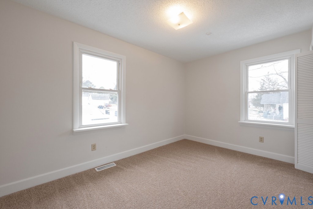 1715 West City Point Road Hopewell, VA 23860 - Photo 9 of 22 an empty room with a window