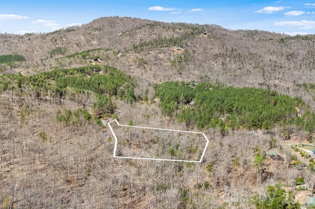 an aerial view of house with mountain view