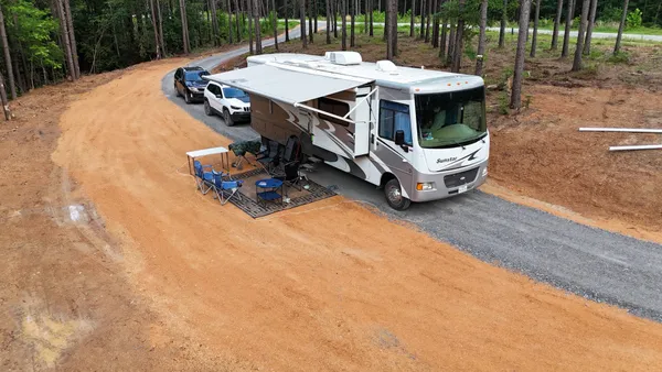 a view of a patio with a table and chairs