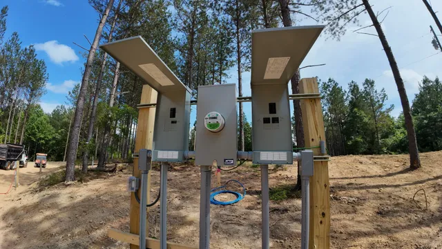 a view of river and trees in the background