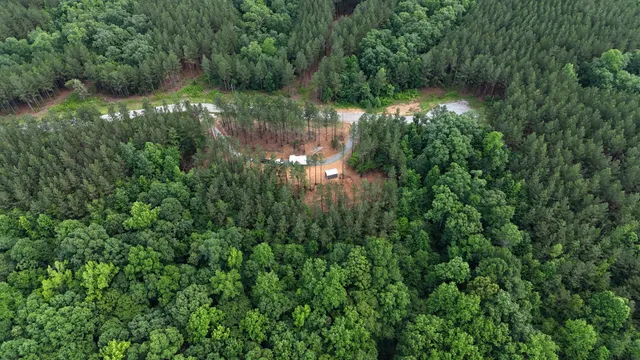 a view of a patio with table and chairs with wooden floor and fence