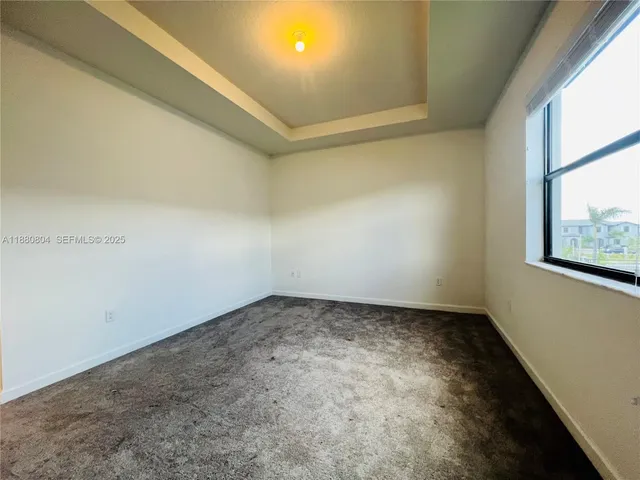 an empty room with a windows