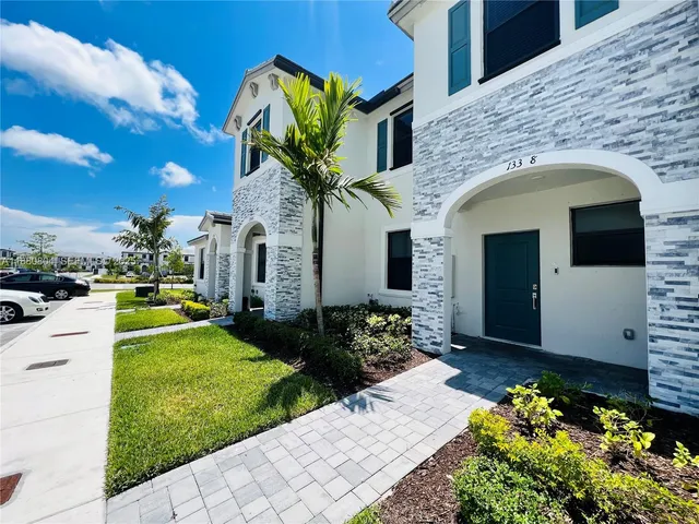 a view of a backyard with sitting area