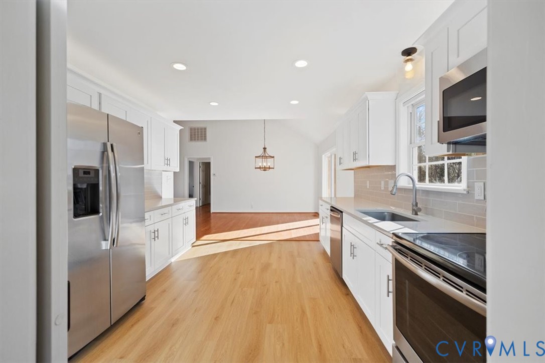 4255 Pierce Road Powhatan, VA 23139 - Photo 14 of 34 Kitchen with white cabinetry, stainless steel appl