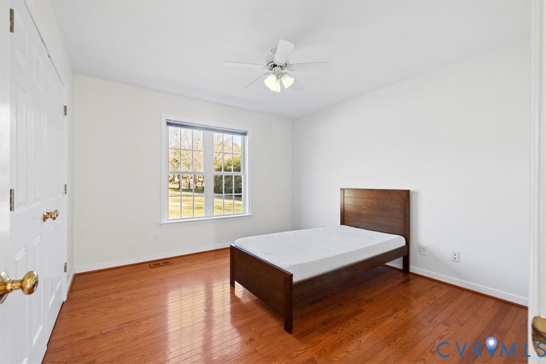 4255 Pierce Road Powhatan, VA 23139 - Photo 19 of 34 Bedroom featuring wood-type flooring, a closet, an