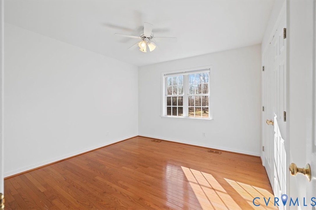 4255 Pierce Road Powhatan, VA 23139 - Photo 20 of 34 Empty room with light wood-style flooring and a ce