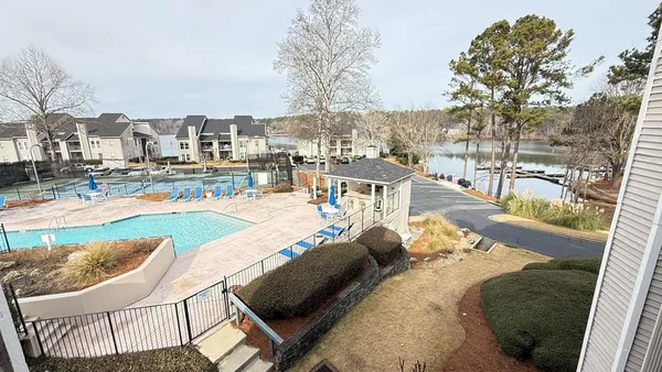 a view of a swimming pool with lounge chairs