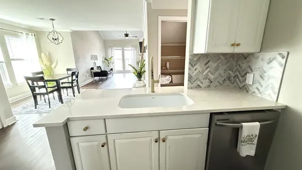 a kitchen with a sink and cabinets