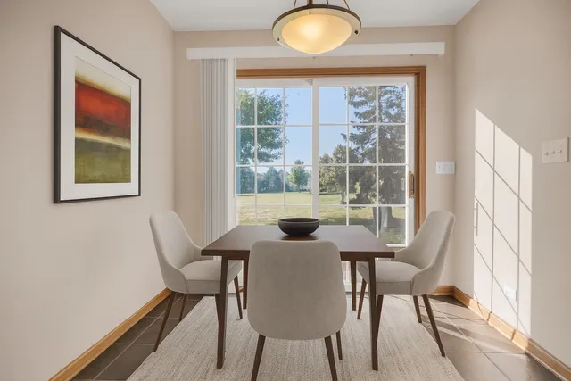 a view of a dining room with furniture window and outside view