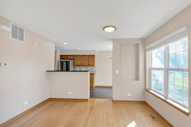 a kitchen with a stove a sink and a microwave
