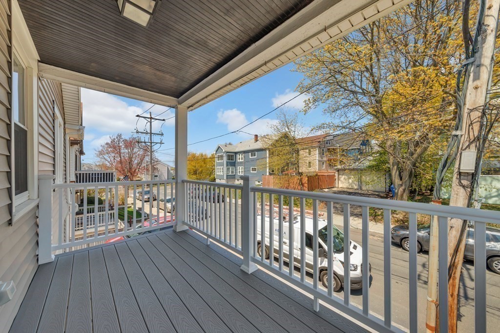9-11 Locust Street, Unit 2 Winthrop, MA 02152 - Photo 37 of 41 a view of a balcony with wooden floor