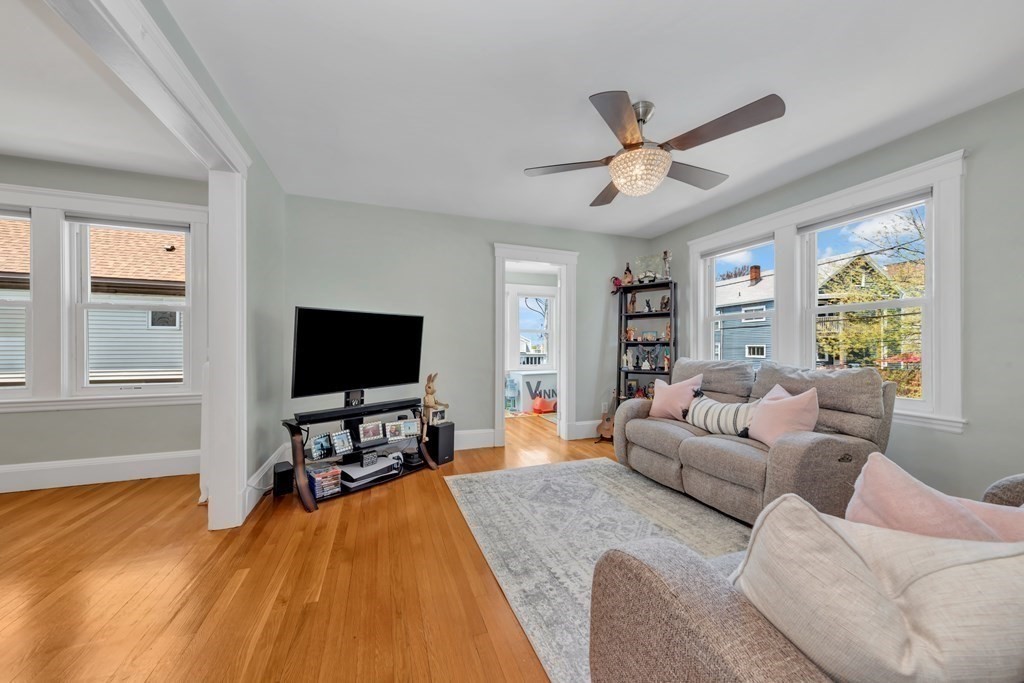 9-11 Locust Street, Unit 2 Winthrop, MA 02152 - Photo 4 of 41 a living room with furniture and a flat screen tv