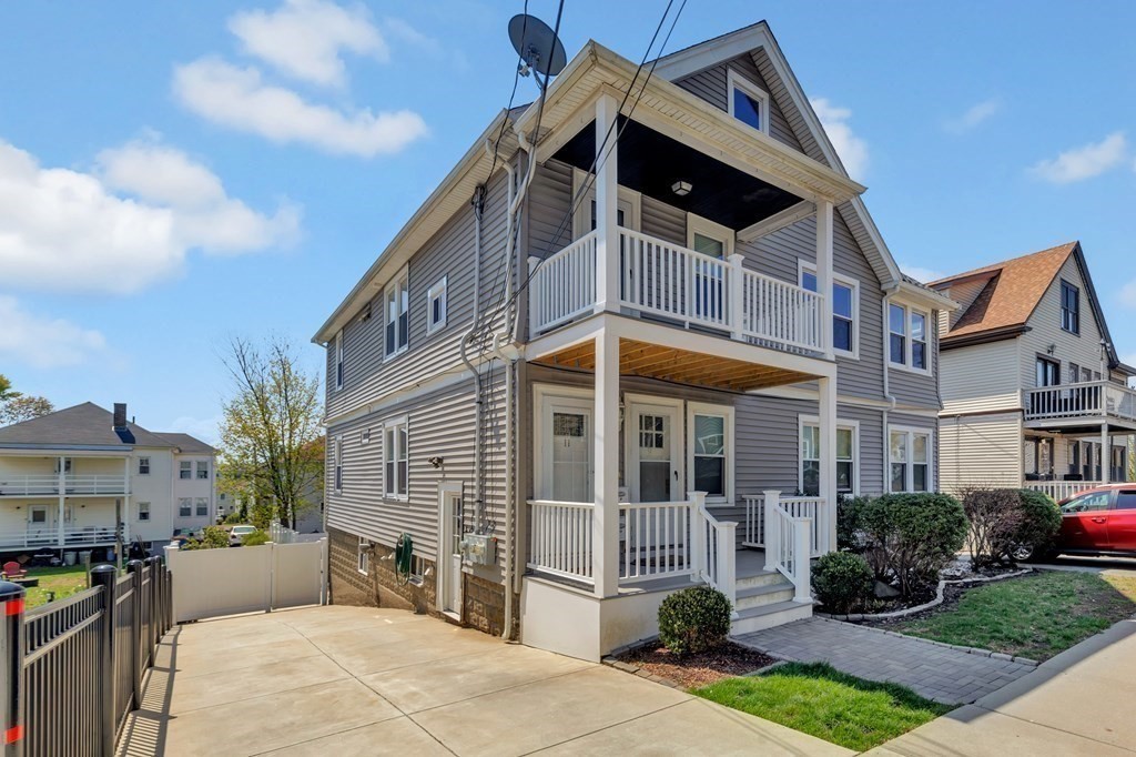 9-11 Locust Street, Unit 2 Winthrop, MA 02152 - Photo 41 of 41 a view of a house with a yard