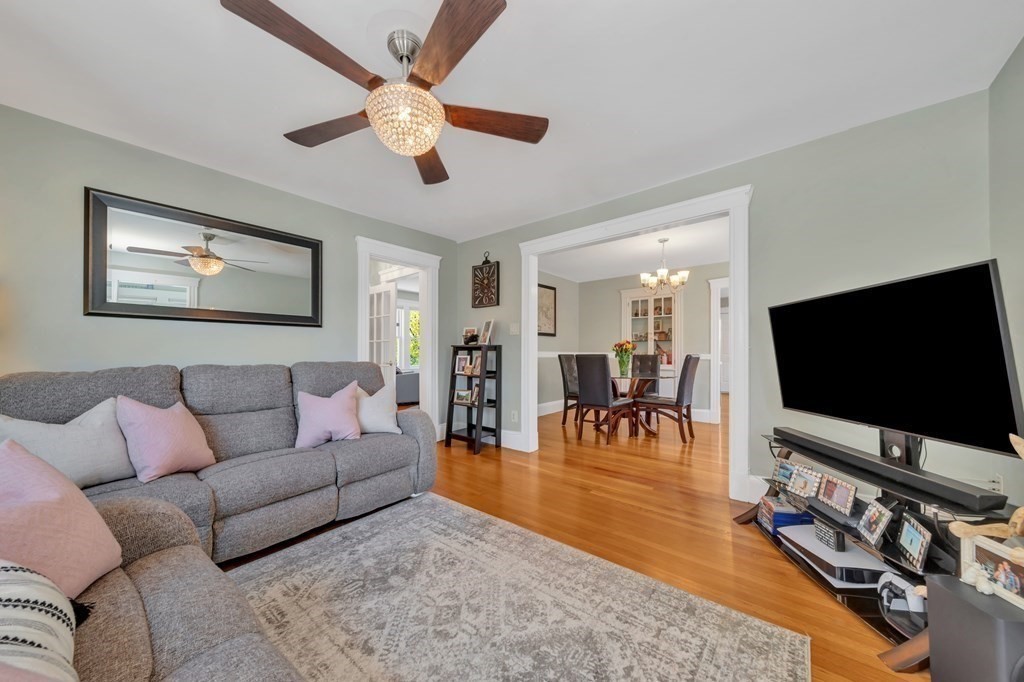 9-11 Locust Street, Unit 2 Winthrop, MA 02152 - Photo 6 of 41 a living room with furniture and a flat screen tv