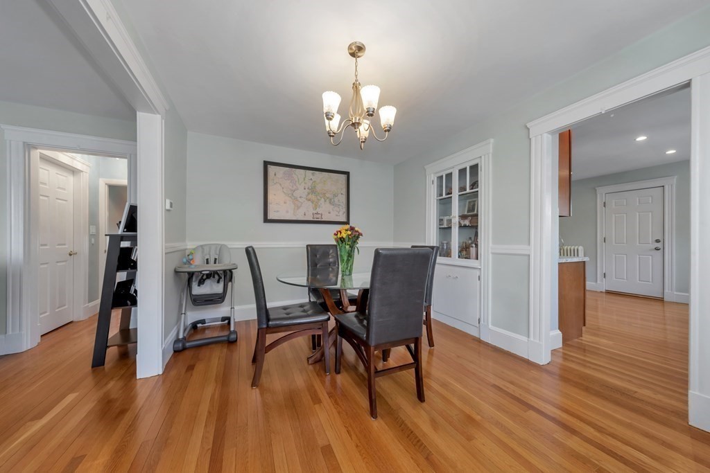 9-11 Locust Street, Unit 2 Winthrop, MA 02152 - Photo 7 of 41 a view of a dining room with furniture and wooden floor