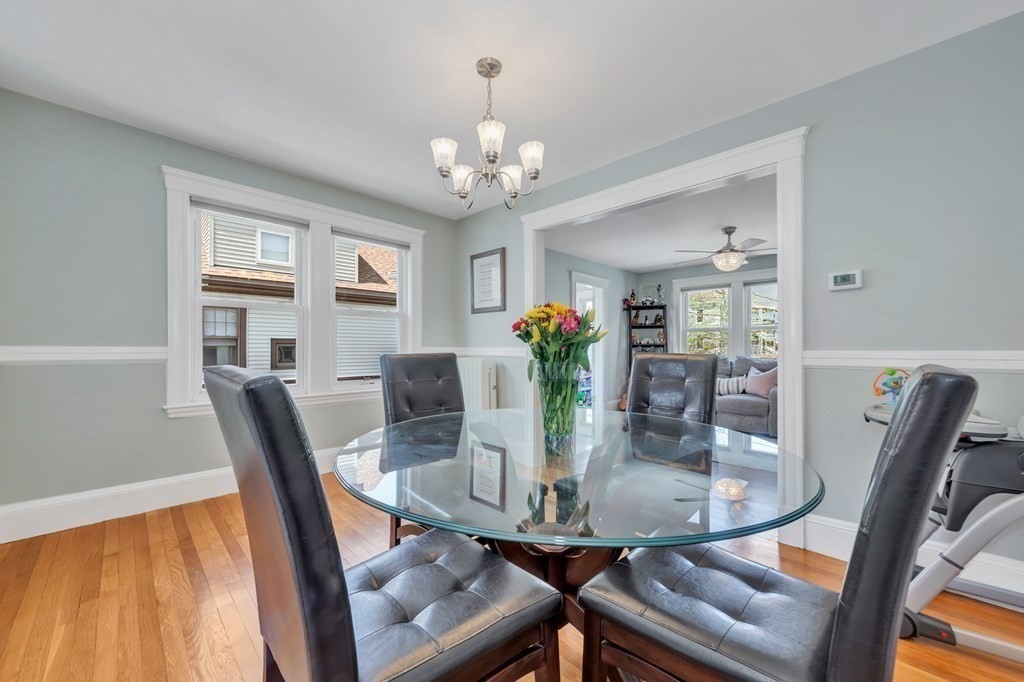 9-11 Locust Street, Unit 2 Winthrop, MA 02152 - Photo 10 of 41 a view of a dining room with furniture and a chandelier