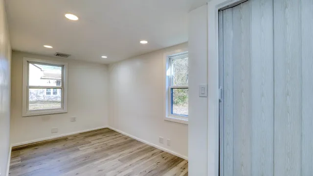 a view of an empty room and window