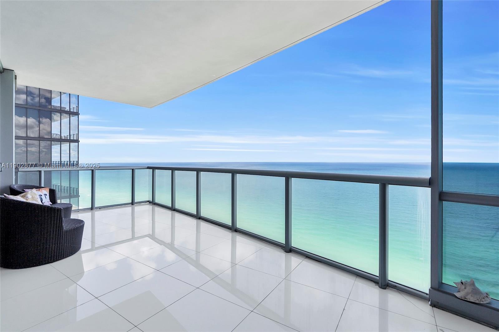 17121 Collins Avenue, Unit 2906 Sunny Isles Beach, FL 33160 - Photo 1 of 42 a view of a livingroom with furniture