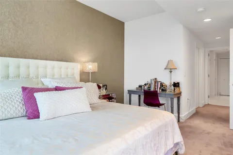 a bathroom with double vanity sinks a vanity and a mirror