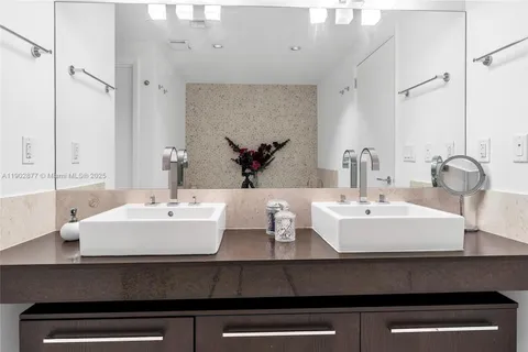 a bathroom with a bathtub and a sink