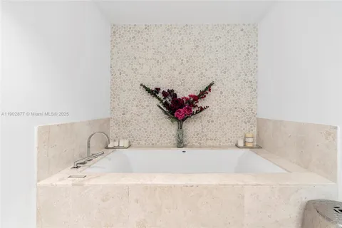 a bathroom with a sink double vanity and a mirror