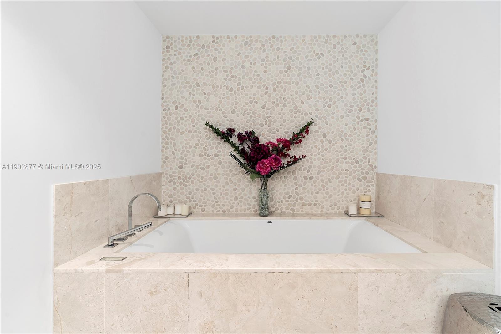 17121 Collins Avenue, Unit 2906 Sunny Isles Beach, FL 33160 - Photo 24 of 42 a bathroom with a bathtub and a sink