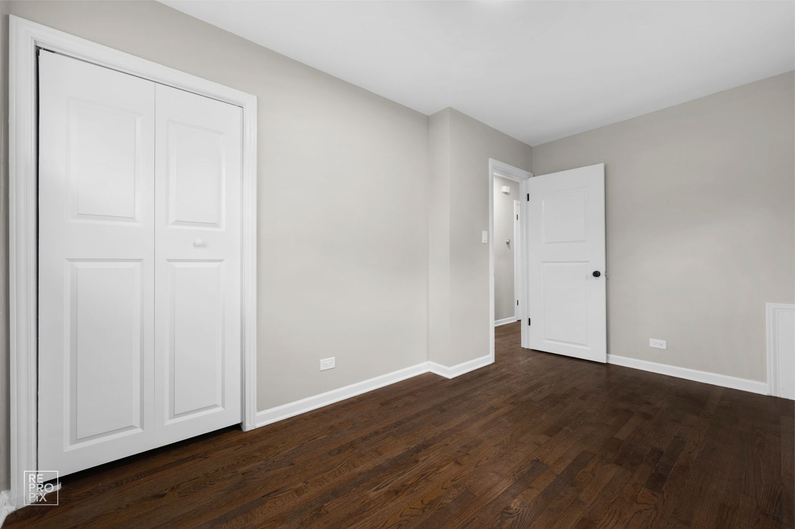 10854 Lyman Avenue Chicago Ridge, IL 60415 - Photo 7 of 10 a view of an empty room with wooden floor