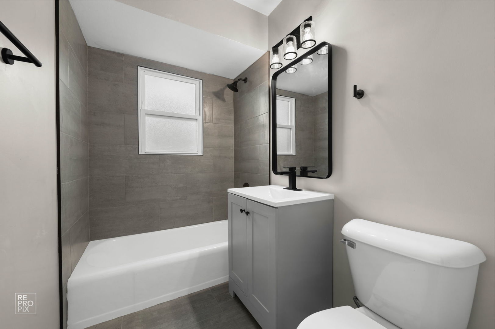 10854 Lyman Avenue Chicago Ridge, IL 60415 - Photo 8 of 10 a bathroom with a toilet sink and mirror