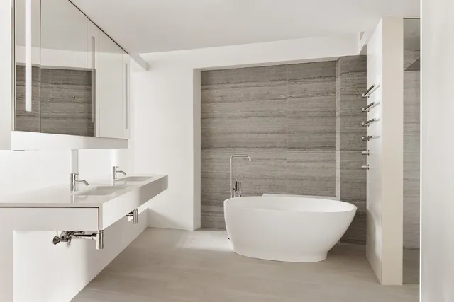 a lobby with furniture and a fireplace