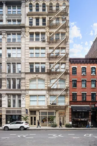a view of a livingroom with furniture and a window