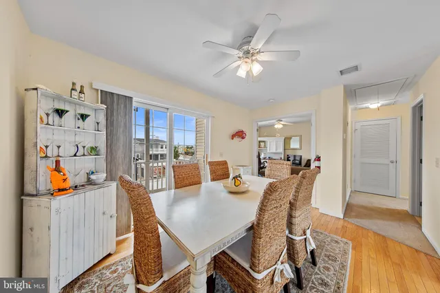 a living room with furniture and a kitchen view