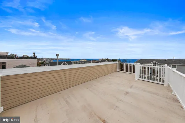an aerial view of a city with ocean view