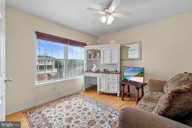 a living room with furniture and a rug