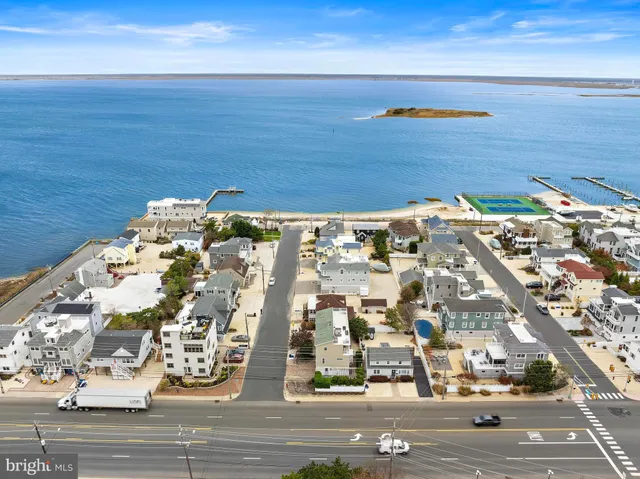 an aerial view of a building with an ocean view