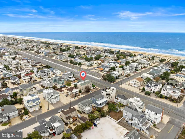an aerial view of multiple houses with outdoor space