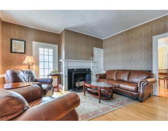 117 South Main Street Middleboro, MA 02346 - Photo 11 of 30 a living room with furniture and a fireplace