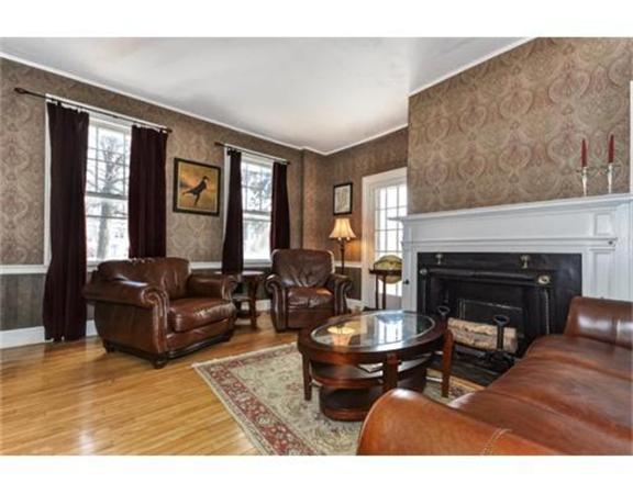 117 South Main Street Middleboro, MA 02346 - Photo 12 of 30 a living room with furniture a fireplace and a large window