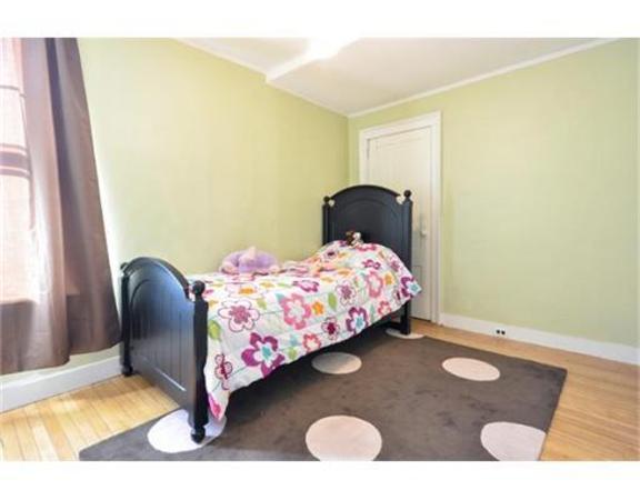 117 South Main Street Middleboro, MA 02346 - Photo 19 of 30 a bedroom with a bed and wooden floor