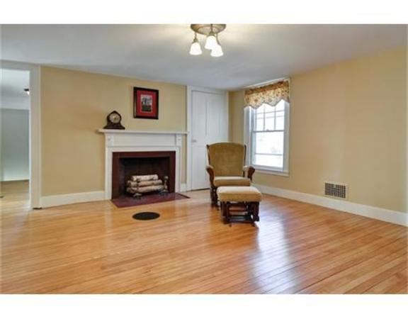 117 South Main Street Middleboro, MA 02346 - Photo 20 of 30 a living room with furniture and a fireplace