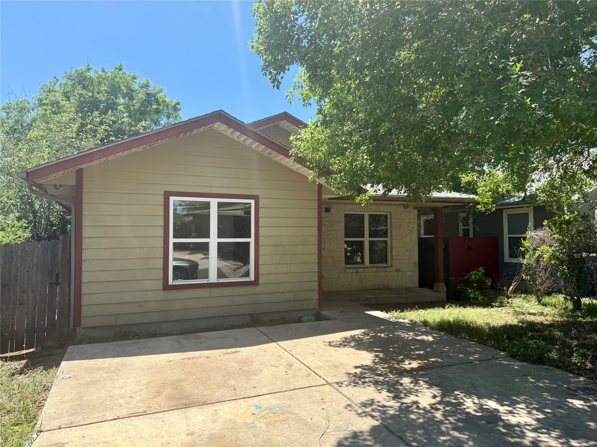 7307 Thannas Way Austin, TX 78744 - Photo 1 of 1 Back of property featuring fence and a patio area
