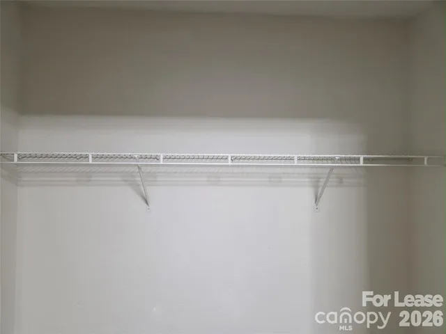 a view of a room with racks on the wall